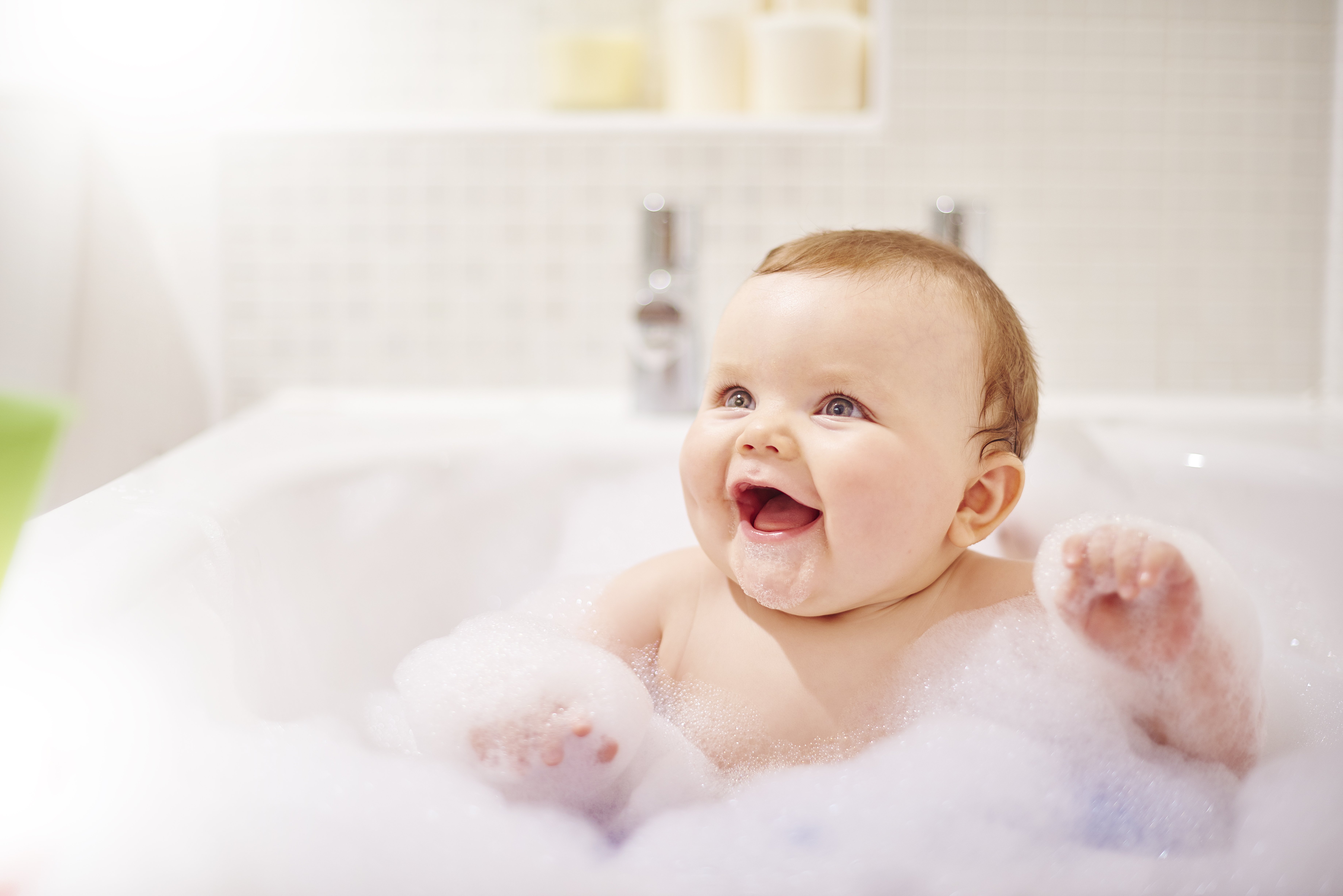 baby in a bubble bath treating eczema