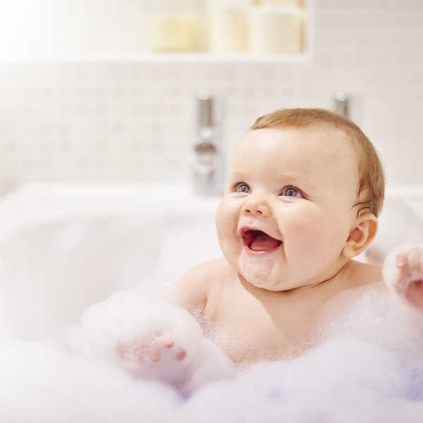baby in a bubble bath treating eczema